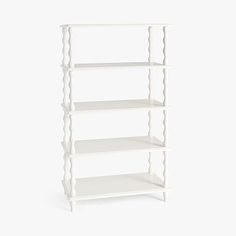 a white shelving unit with four shelves on one side and three levels on the other