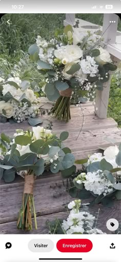 flowers and greenery are arranged on a wooden bench for an instagram photo shoot