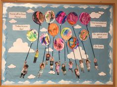 a bulletin board with different types of doughnuts and clouds in the sky on it