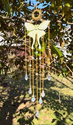 a wind chime hanging from a tree