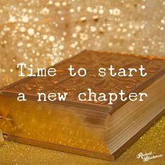 an open book with the words time to start a new charter on it and gold glitters in the background