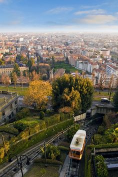 an aerial view of a city with lots of trees