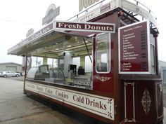 a food truck is parked on the side of the road