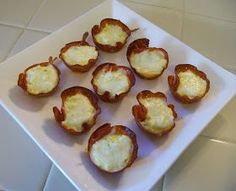 small appetizers are arranged on a square white plate, ready to be eaten