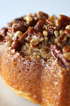 pecan upside - down cake with nuts on top and text overlay that reads pecan upside down cake simple & delicious