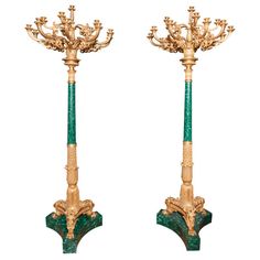 a pair of green and gold candlesticks