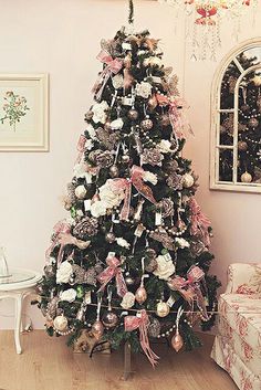 a decorated christmas tree in a living room