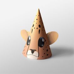 a paper party hat with a cartoon animal face on it's front and side