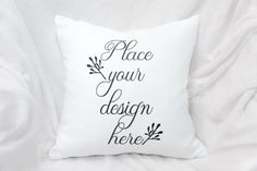 a white pillow with black lettering that says place your design here on the front and back