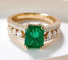 An effervescent emerald captures the spotlight on this 14K gold ring, while the diamond accents play a strong supporting role. Emerald Cut Green Diamond Ring In 14k Gold, Pearl And Emerald Engagement Ring, Vintage Engagement Rings Unique 1920s Emerald, Collectible Green Emerald Ring In 14k Gold, Exquisite Green Emerald Ring In 14k Gold, Diamond And Emerald Engagement Ring, Antique Emerald Engagement Ring, Elegant Multi-stone Emerald Ring In 14k Gold, Emerald And Diamond Engagement Ring