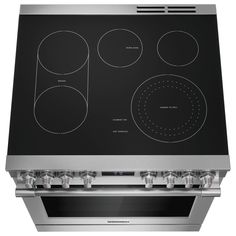 an electric stove with four burners on the front and two ovens on the back