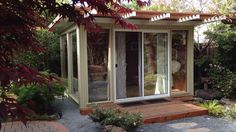 a small garden room with sliding glass doors