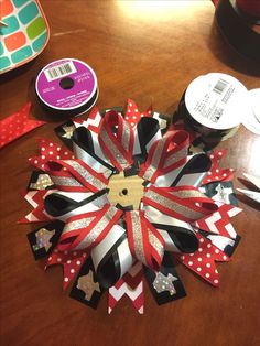 a wooden table topped with lots of ribbon