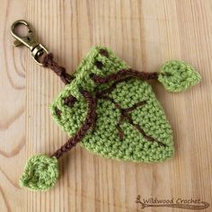 a crocheted keychain with a leaf on it