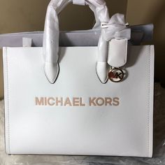 New Michael Kors Mirella Medium Tote Pebbled Leather Shopper Bag Brand New With Tag , 100% Authentic Price Is Firm! Leather Crossbody Strap Included 13.75”W X 10.75”H X 4.75”D Handle Drop: 4.5” Adjustable Strap: 15”-25” Interior Details: Back Zip Pocket, Front Slip Pocket White Leather Shoulder Bag With Logo, White Double Handle Shoulder Bag With Logo, White Shoulder Bag With Logo And Double Handle, Michael Kors Textured Leather Tote Bag, Elegant Daily Use Satchel With Logo, Elegant Logo Satchel For Daily Use, Luxury White Bags For Errands, Luxury Office Bags With Logo, Chic Michael Kors Bag With Logo