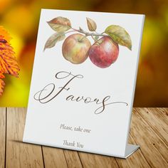 a greeting card with two apples on it and the words, favors please, take one thank you