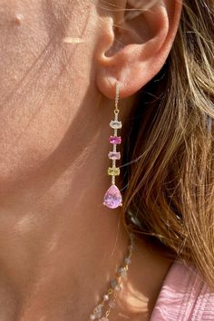 Expertly crafted, these earrings are made with 14K gold vermeil and adorned with a mix of pink multi-cz droplets, measuring at 3 inches. Embrace the vibrant yet elegant design of these huggie earrings that will make a statement for any occasion.