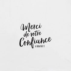 the words merci de votre confiance are written in black ink on a white paper