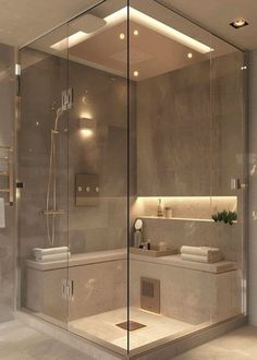 a bathroom with a large glass shower door