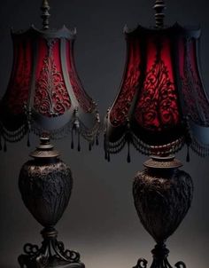 two red lamps sitting next to each other on a table