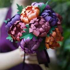 a close up of a bouquet of flowers made out of paper