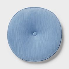 a blue round cushion on a white background