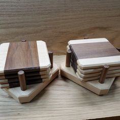 four wooden blocks stacked on top of each other