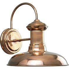 an old fashioned wall light with a brass finish