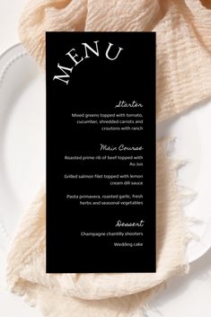 a black and white menu card on a plate