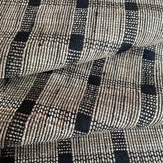 a black and white checkered fabric with small squares on the pattern, closeup