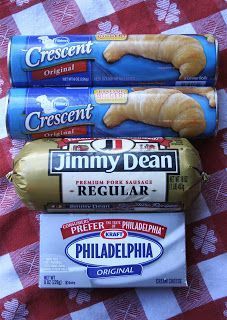 three packages of food are sitting on a picnic table with red and white checkered cloth