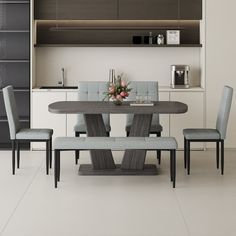 a dining room table with four chairs and a bench in front of an open shelf