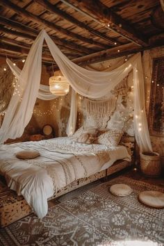 a bed with white curtains and lights hanging from it's ceiling in a bedroom