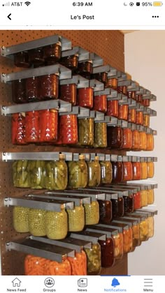 the shelves are filled with many different kinds of pickles and sauces on them