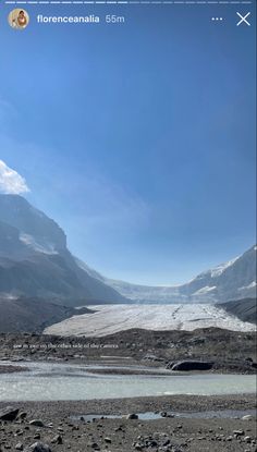 the mountains are covered in snow and ice as well as some small water holes on the ground