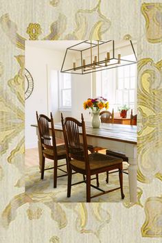 a dining room table with chairs and a vase on it