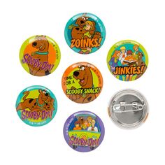 four pinback buttons with cartoon characters on them