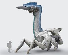 an image of a robot that is sitting on the ground next to a giant snake