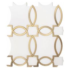 a white and gold tile with circles on it