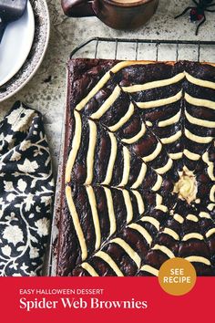 a spider web cake sitting on top of a pan