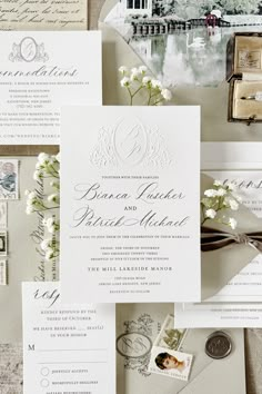 the wedding stationery is laid out on top of each other, including an envelope