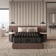 a bedroom with a large bed and a bathtub