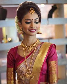 a woman in a red and gold sari