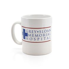 a white coffee mug with the words grey - sloan memorial hospital on it