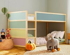 a child's bedroom with bunk beds and toys on the floor in front of them