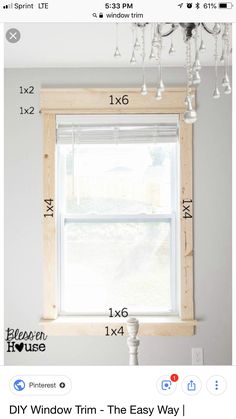 a window with measurements for the size and width of it in front of a white wall