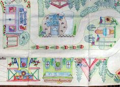 this is an image of a child's hand drawn map with houses and cars