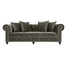 a gray couch with some pillows on it