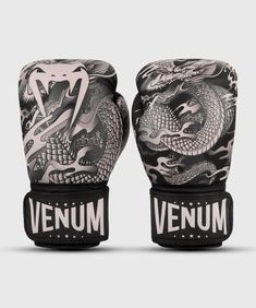 an image of a pair of gloves with dragon designs on the front and back of them