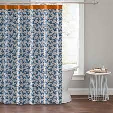 a blue and white shower curtain in a bathroom